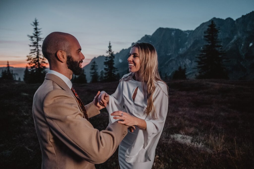 Couple laughing together at dusk.
