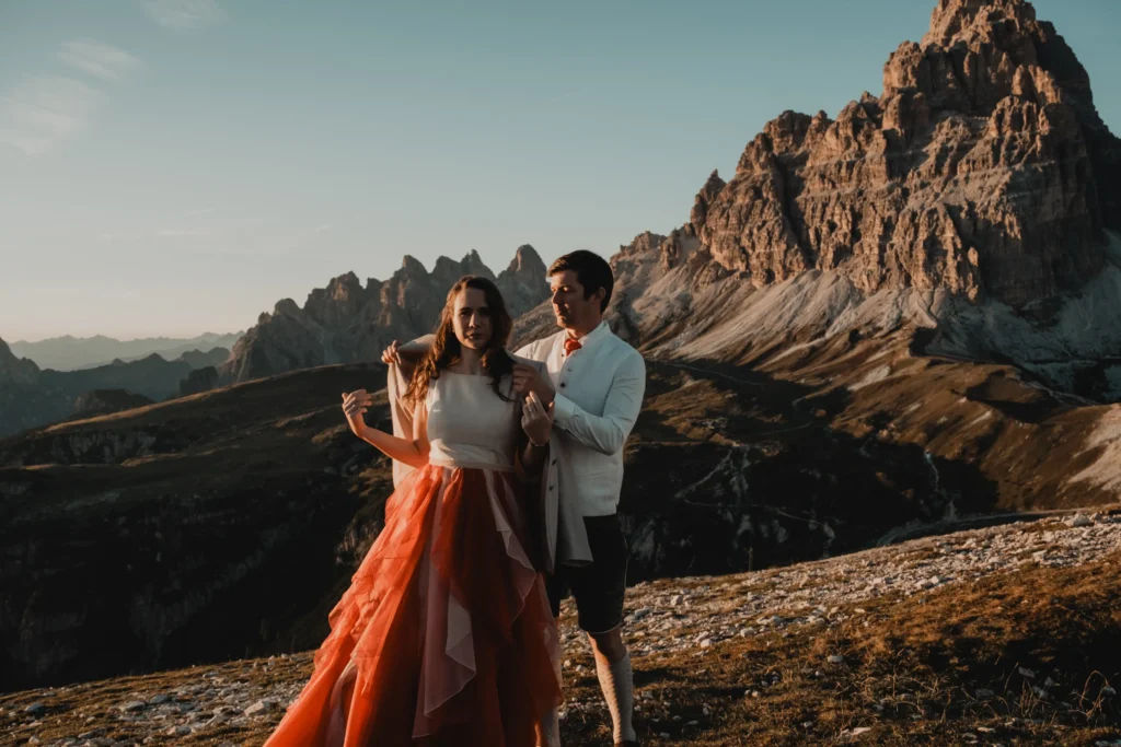Couple moving together along a mountain ridge.