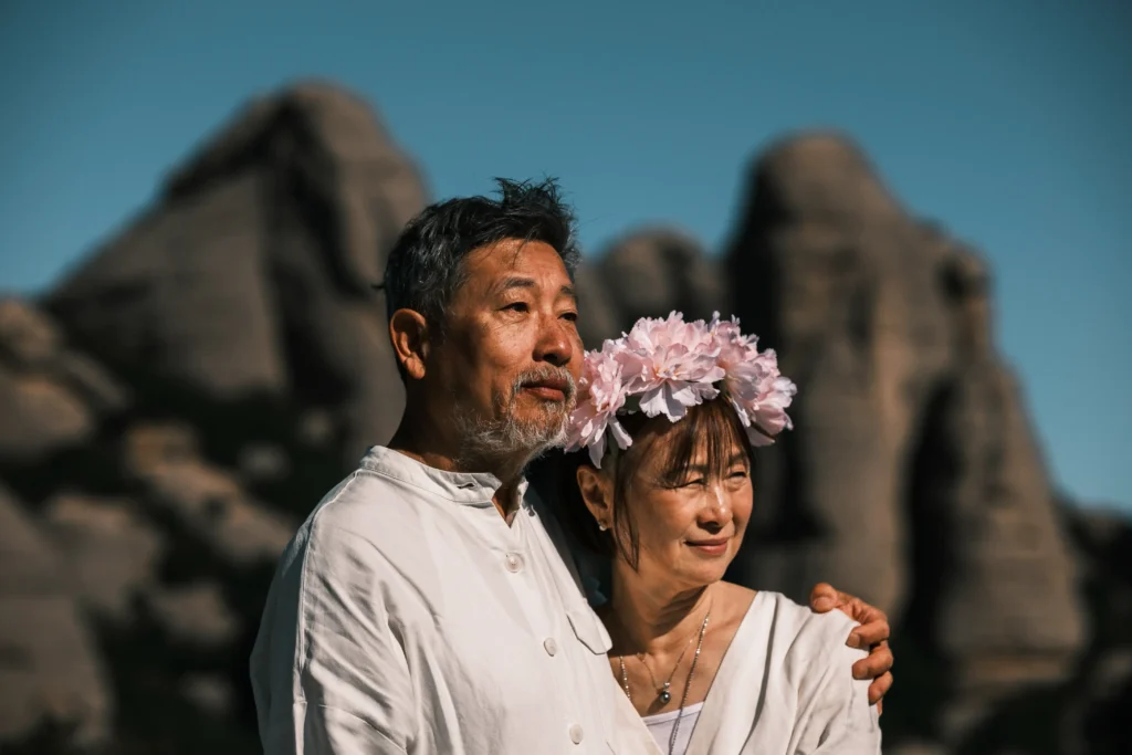 Close portrait of a bride wearing a pink flower crown.