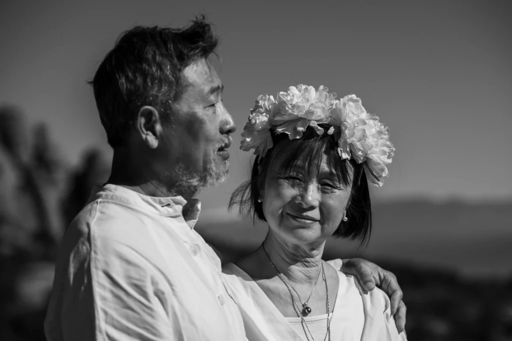 Black-and-white portrait of a bride wearing a flower crown.